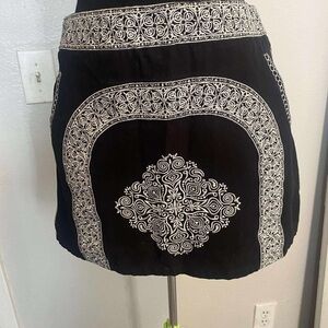 Elegant Black Mini Skirt with Intricate White Patterns